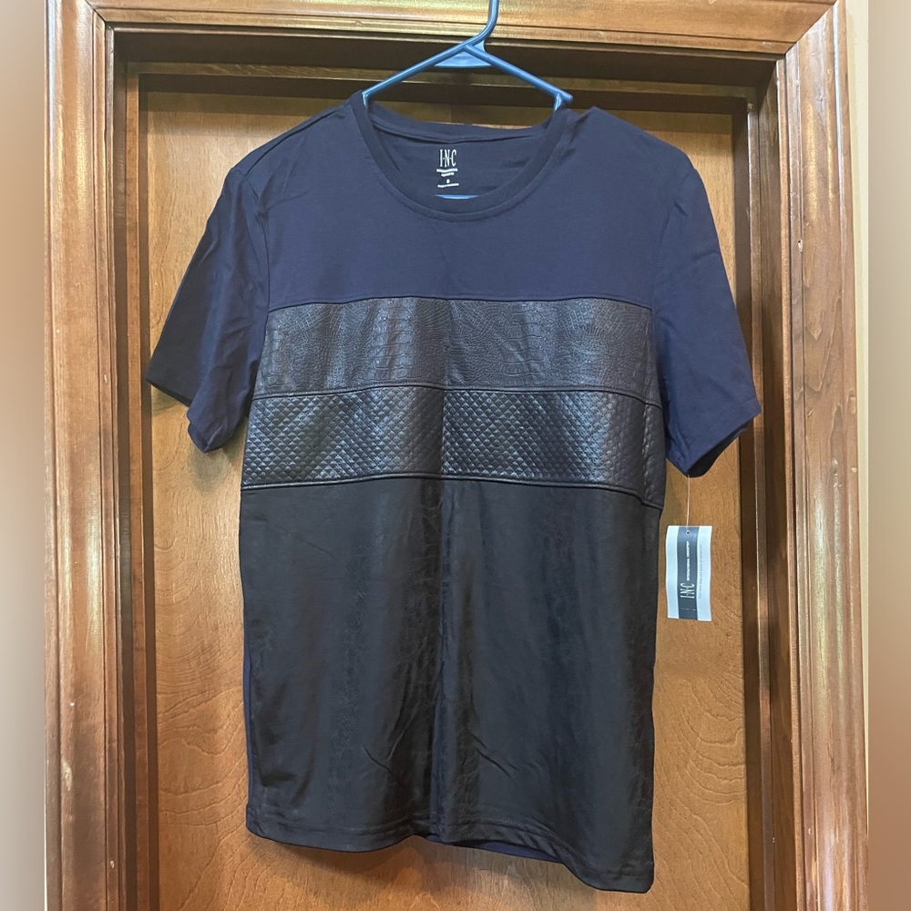 Navy blue tee shirt; Front of shirt Resembles faux leather.